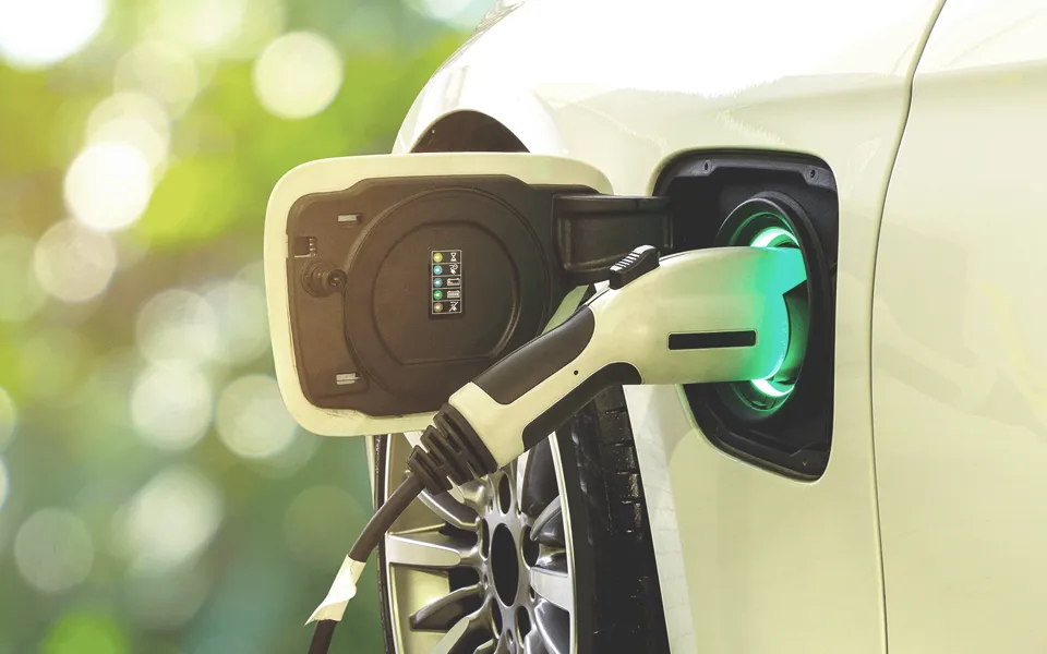 Electric Vehicle Charging Plugged In