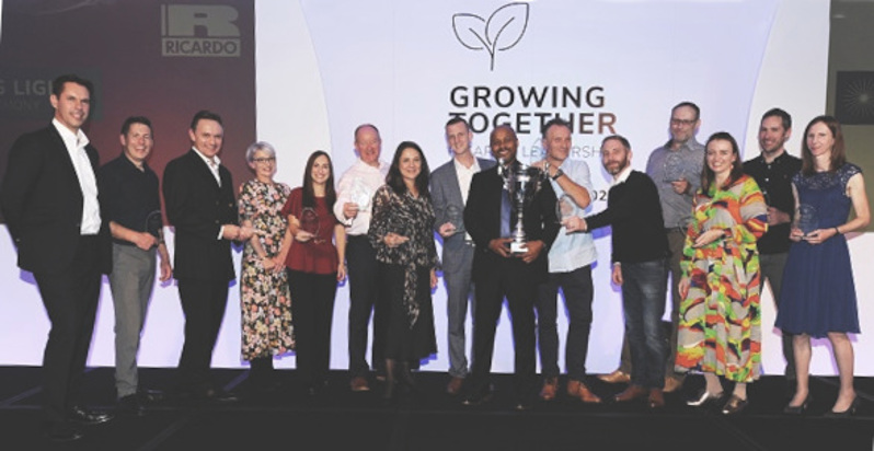 Group of people on a stage collecting awards at Ricardo leading lights awards.