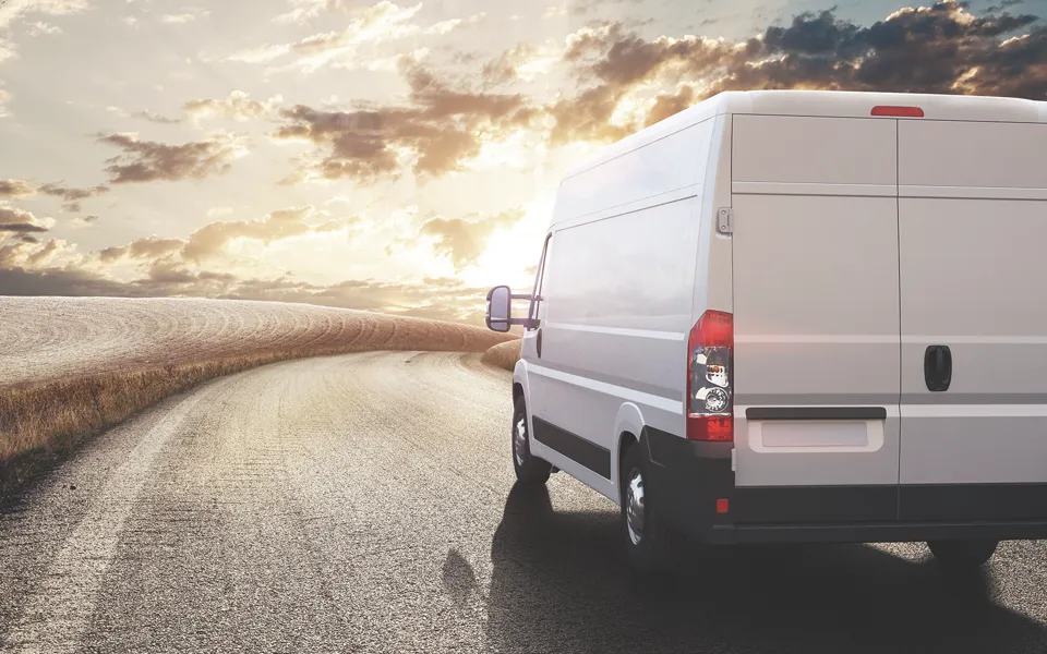 Van driving along road