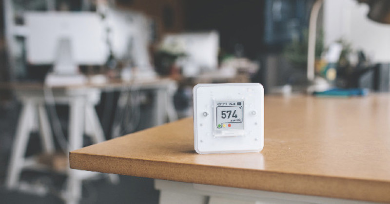 Air quality sensor sat on a table.