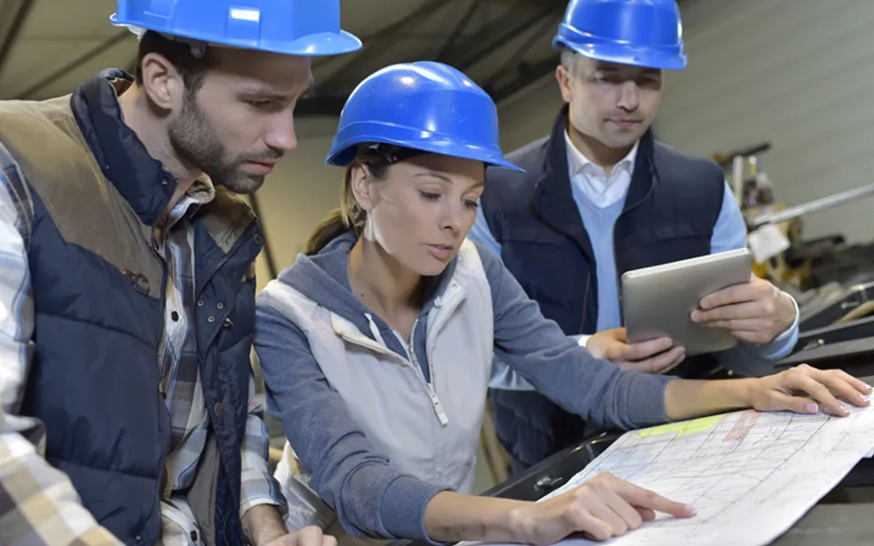 Engineers Looking At Plan