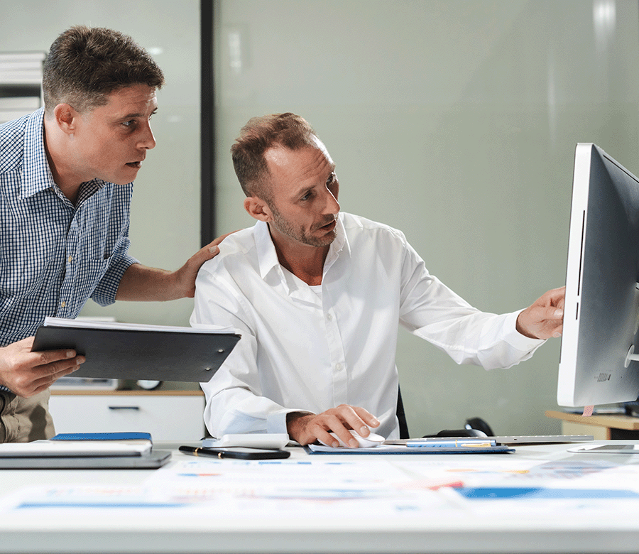 Planning Managers Pointing At Screen