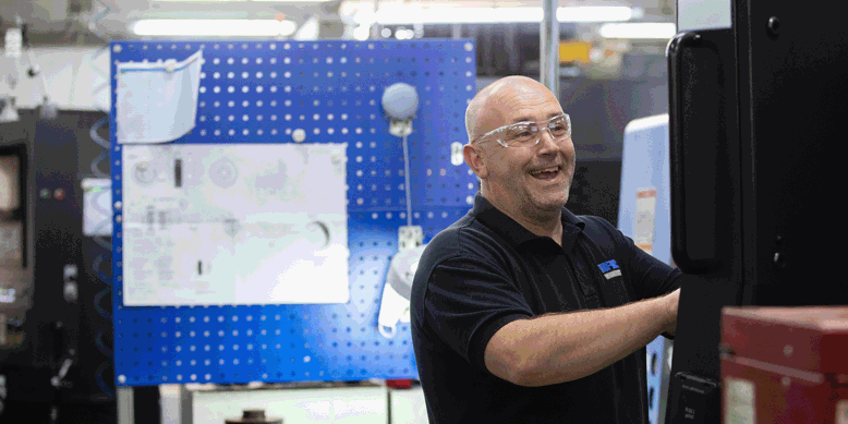 Ricardo employee using CNC machine
