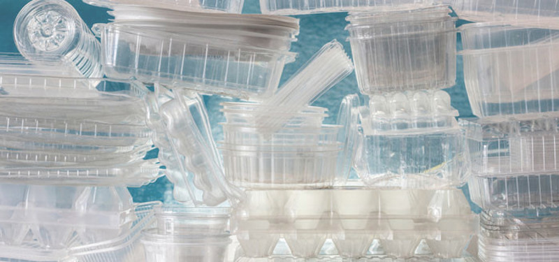 Stacks of a variety of types of clear plastic packaging