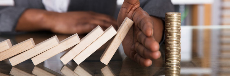 Hand stopping dominoes